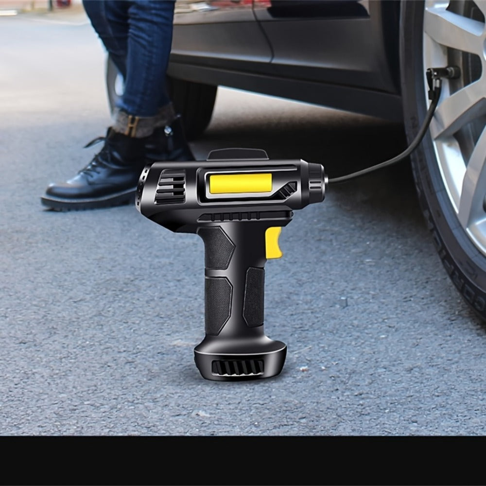 Black and yellow cordless drill on a car tire with a person in blue jeans and black shoes in the background.